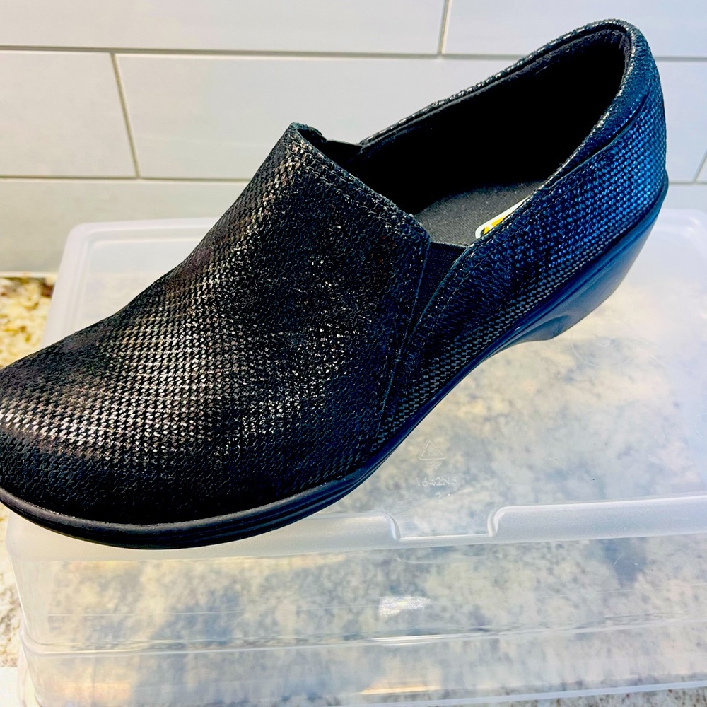 Clarks black Slip-on black shoe with slip resistant sole. Like new.